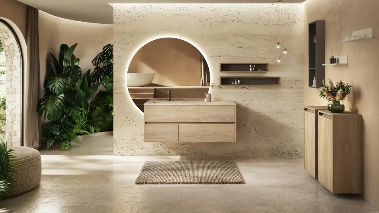 Une salle de bain moderne avec des plantes luxuriantes, un meuble vasque en bois flottant et un miroir rond lumineux. Une belle inspiration salle de bain.