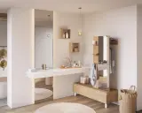 Salle de bain ouverte sur chambre, avec baignoire, lavabo, et dressing. Ambiance épurée et naturelle.