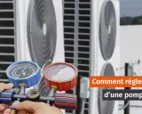 Main d'un technicien ajustant la pression d'une pompe à chaleur air-air avec un manomètre.